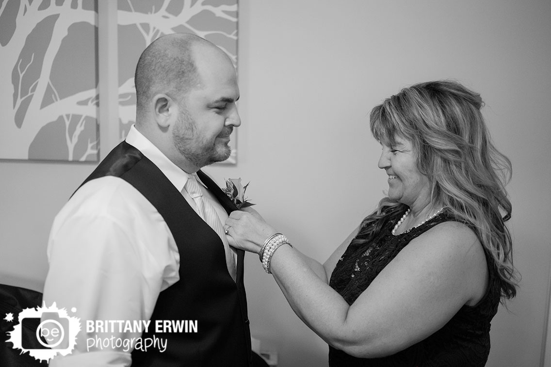 Mother-of-groom-pinning-on-boutonniere.jpg