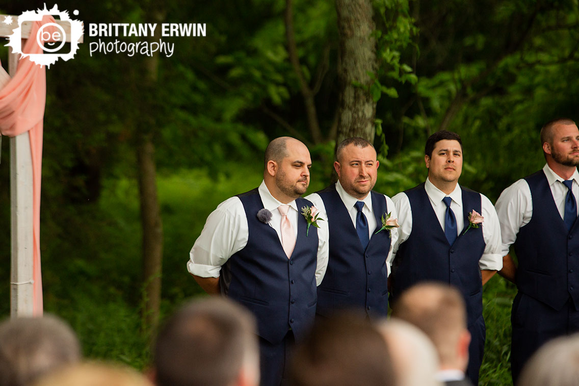 groom-at-altar-waiting-for-bride-at-ceremony.jpg