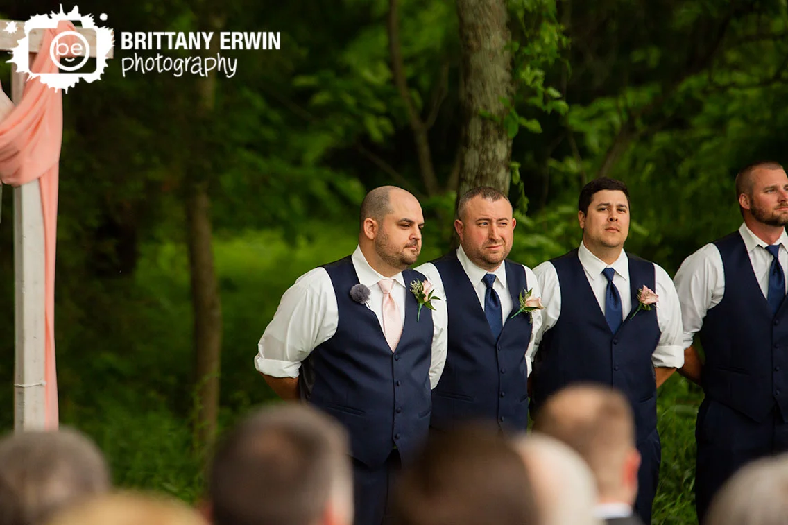 groom-at-altar-waiting-for-bride-at-ceremony.jpg