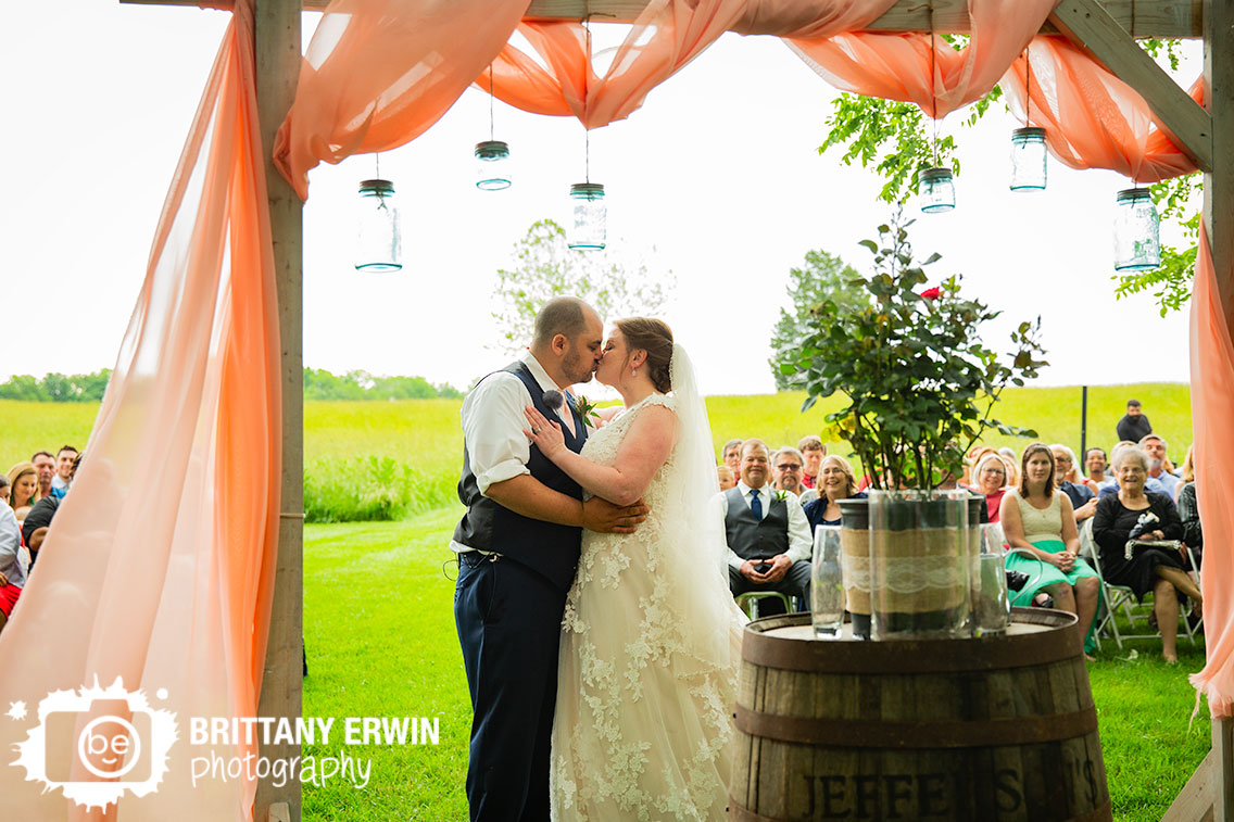 Shelbyville-Indiana-outdoor-summer-wedding-ceremony-first-kiss.jpg