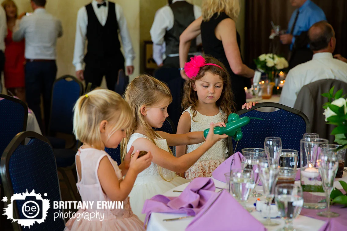 flower-girl-making-balloon-animals-at-wedding-reception.jpg