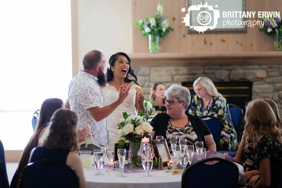 bride-laughing-with-donut-during-wedding-reception.jpg