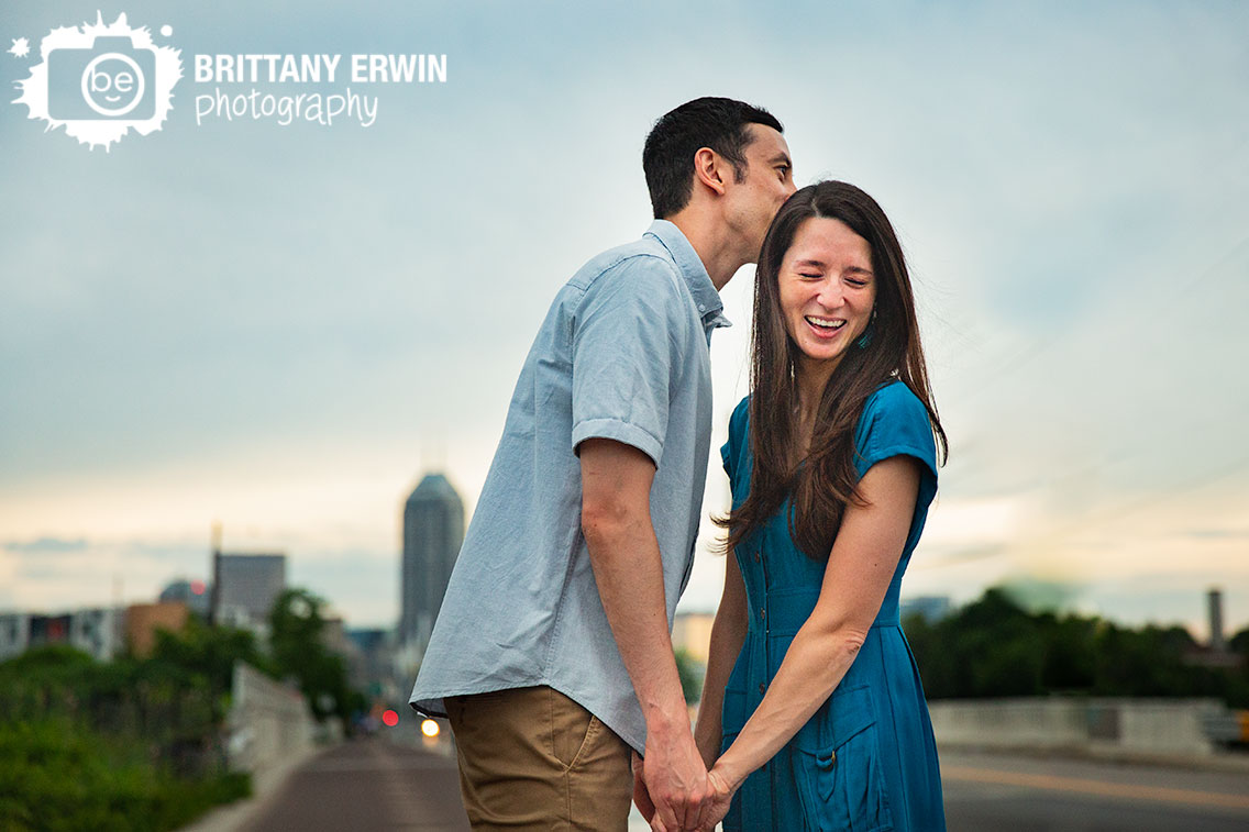 Fountain-Square-Indiana-engagement-portrait-photographer-laughing-kiss.jpg
