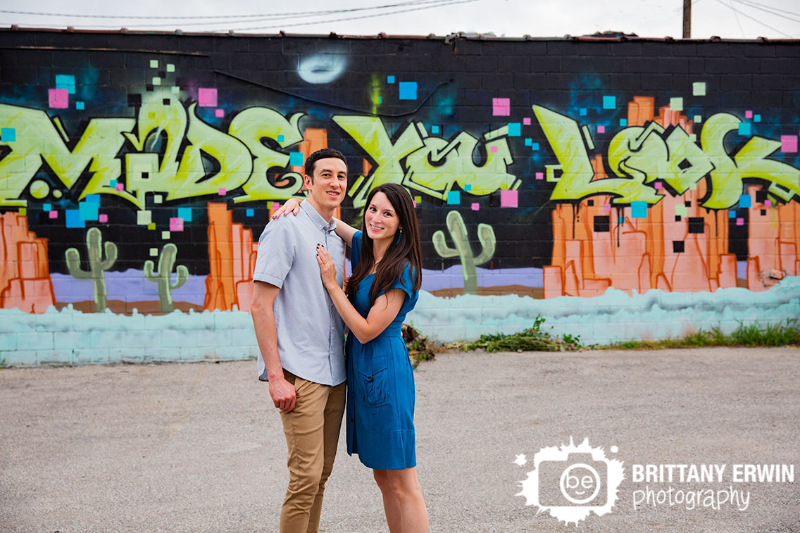 Fountain-Square-engagement-portrait-photographer-made-you-look-mural-couple-outdoor.jpg