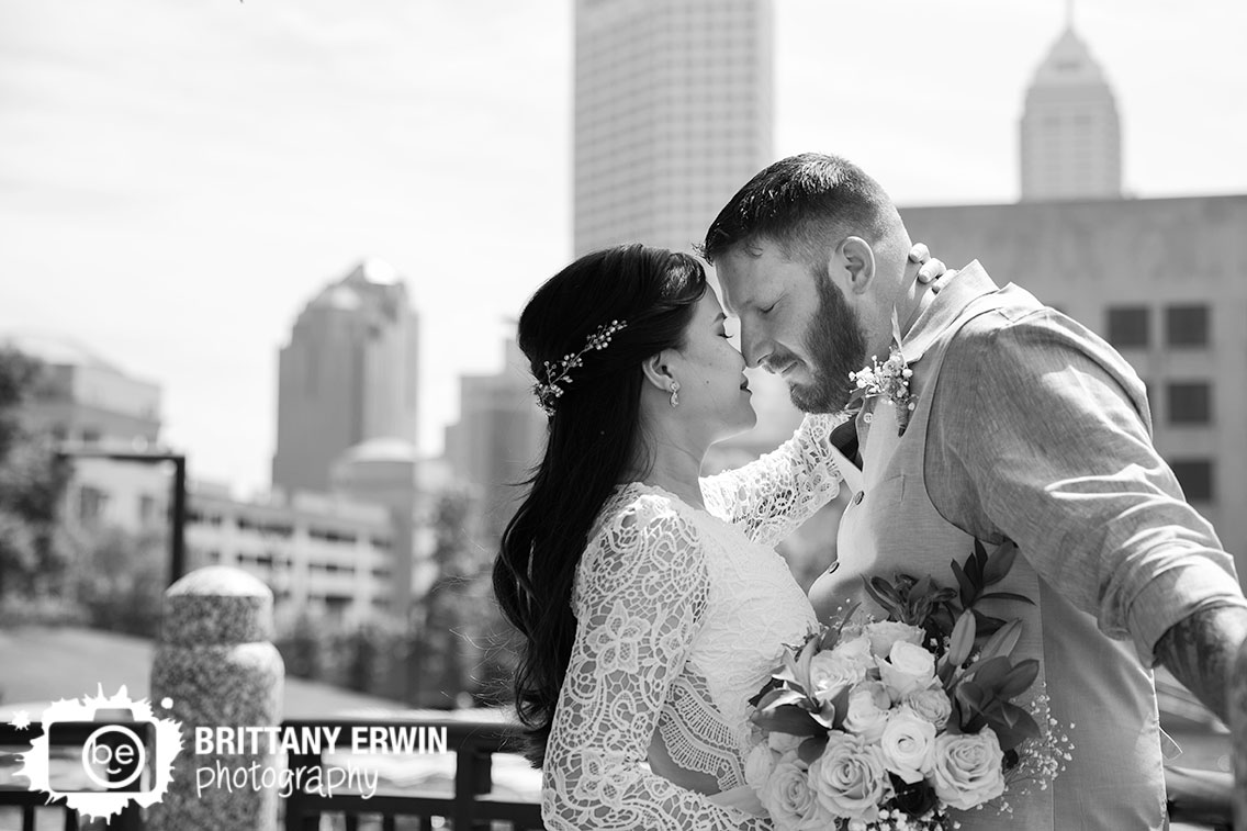 Downtown-Indianapolis-elopement-photographer-couple-with-skyline-on-canal.jpg