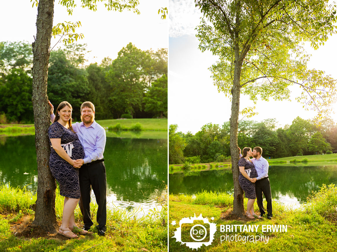 Indianapolis-sunset-maternity-portrait-session-couple-by-pond-with-tree-reflection.jpg