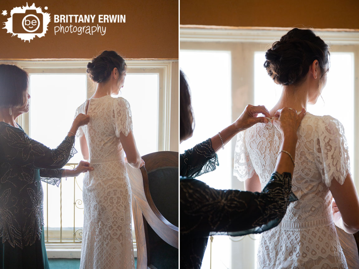 Fountain-Square-Theatre-bride-getting-ready-mother-zipping-up-lace-dress-back.jpg