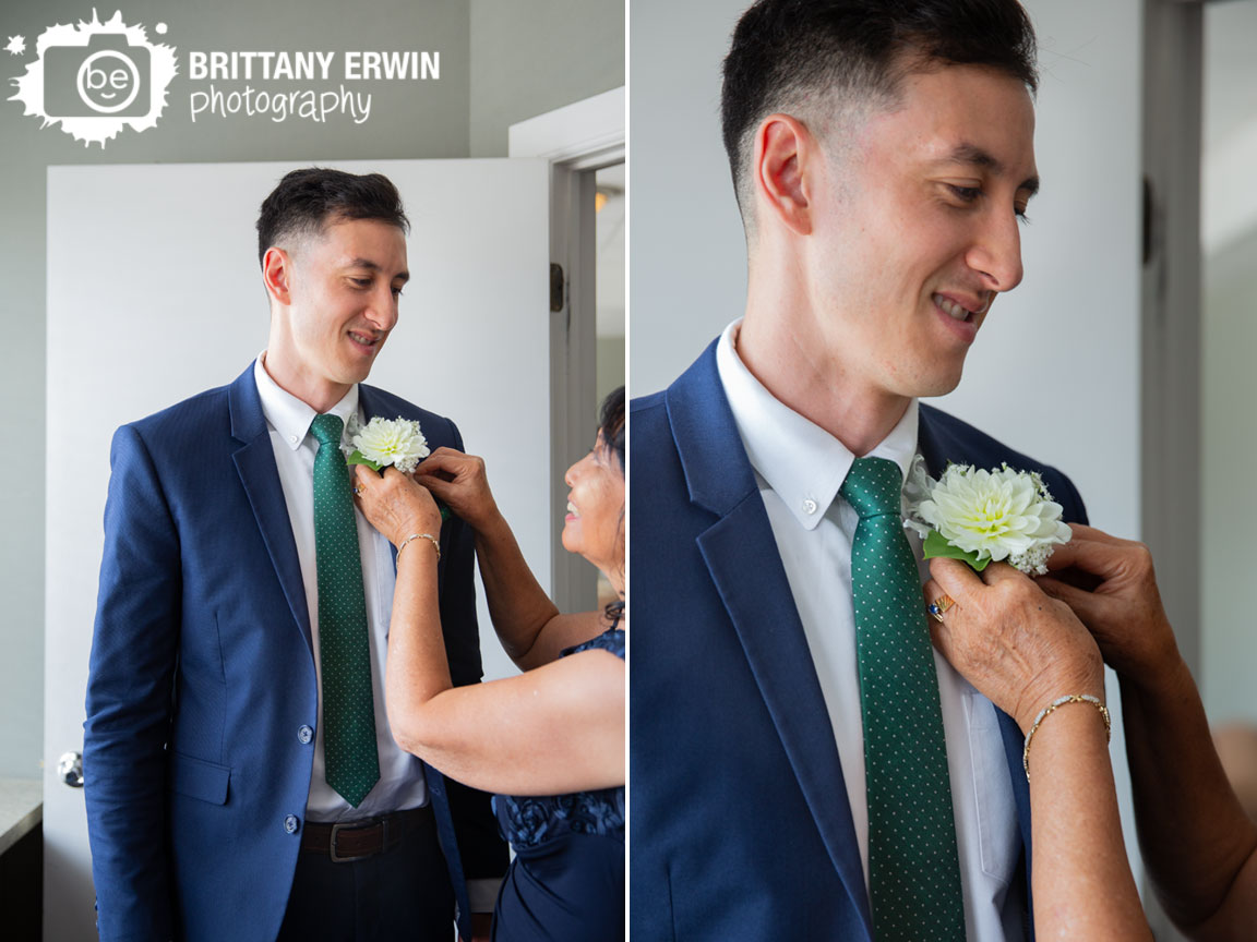 Fountain-Square-Indiana-wedding-photographer-groom-boutonniere-pinned-on-by-mother.jpg