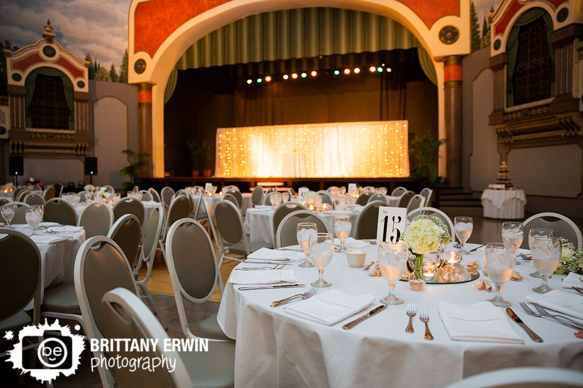 Fountain-Square-Theater-wedding-reception-space-stage-twinkle-lights-flower-centerpiece.jpg