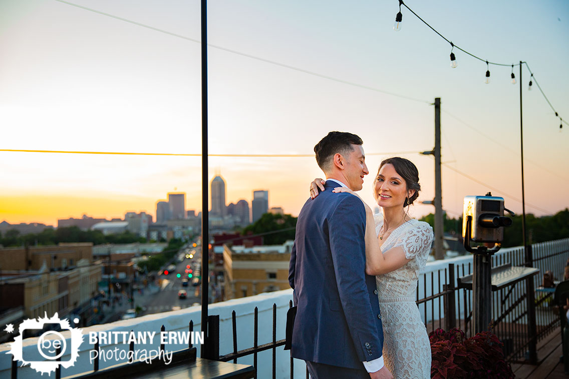 Fountain-Square-Theater-wedding-photographer-rooftop-skyline-view-at-sunset-bridal-couple.jpg