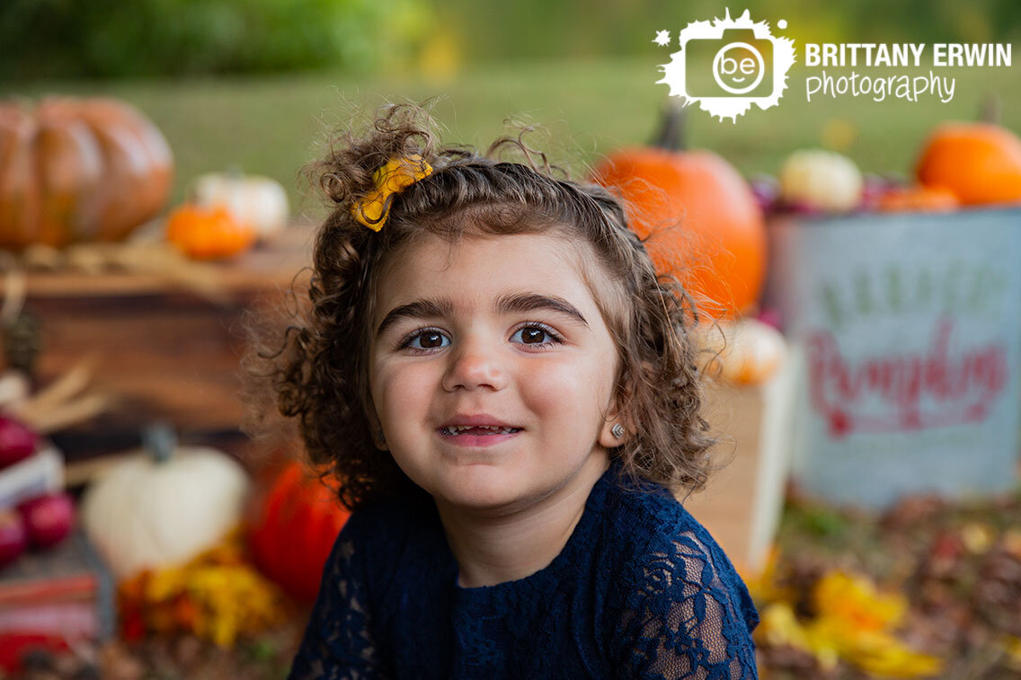Indianapolis-portrait-photographer-toddler-girl-blue-lace-dress-pumpkins-fall.jpg