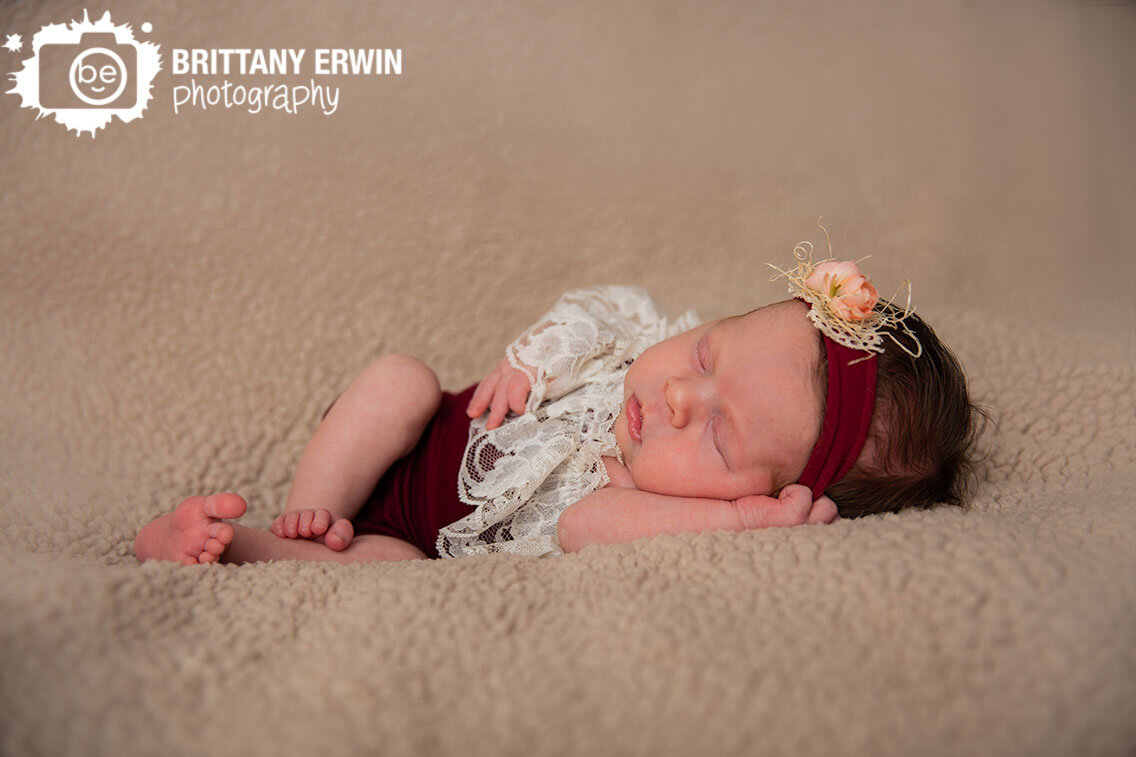 Indianapolis-newborn-baby-girl-studio-photographer-sherpa-blanket-burgundy-lace-onesie-matching-headband.jpg