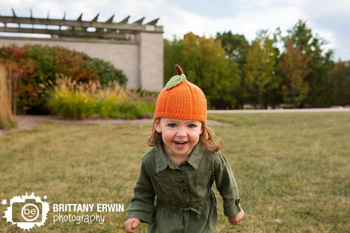 pumpkin-hat-toddler-playing-in-grass-coxhall-gardens.jpg