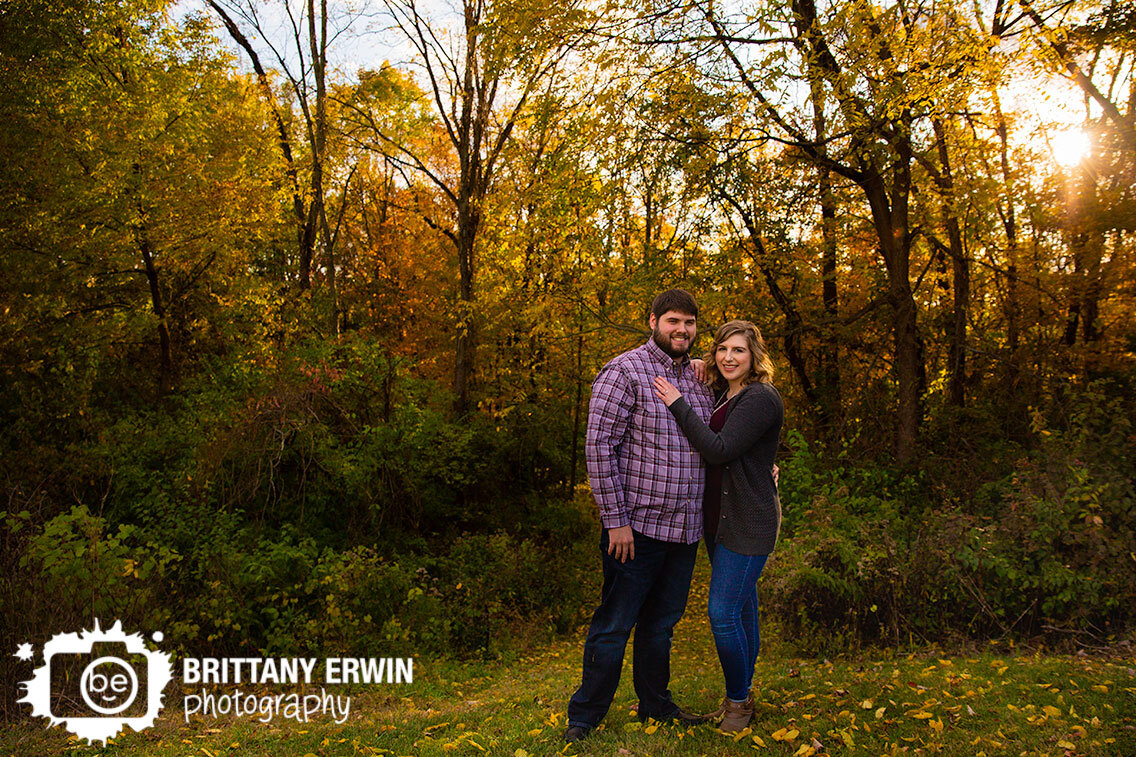Indianapolis-couple-engagement-portrait-photographer-sunset-coming-through-fall-trees.jpg