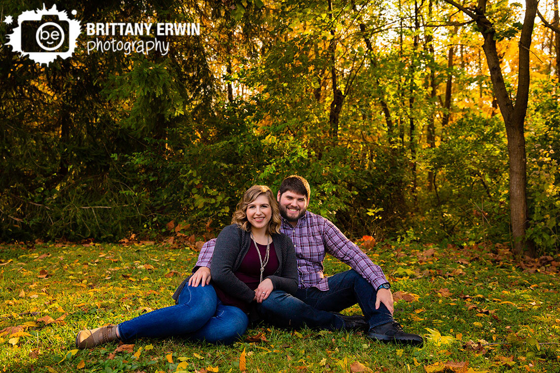 Indianapolis-couple-sunset-fall-portrait-leaves-autumn-sitting-in-grass.jpg