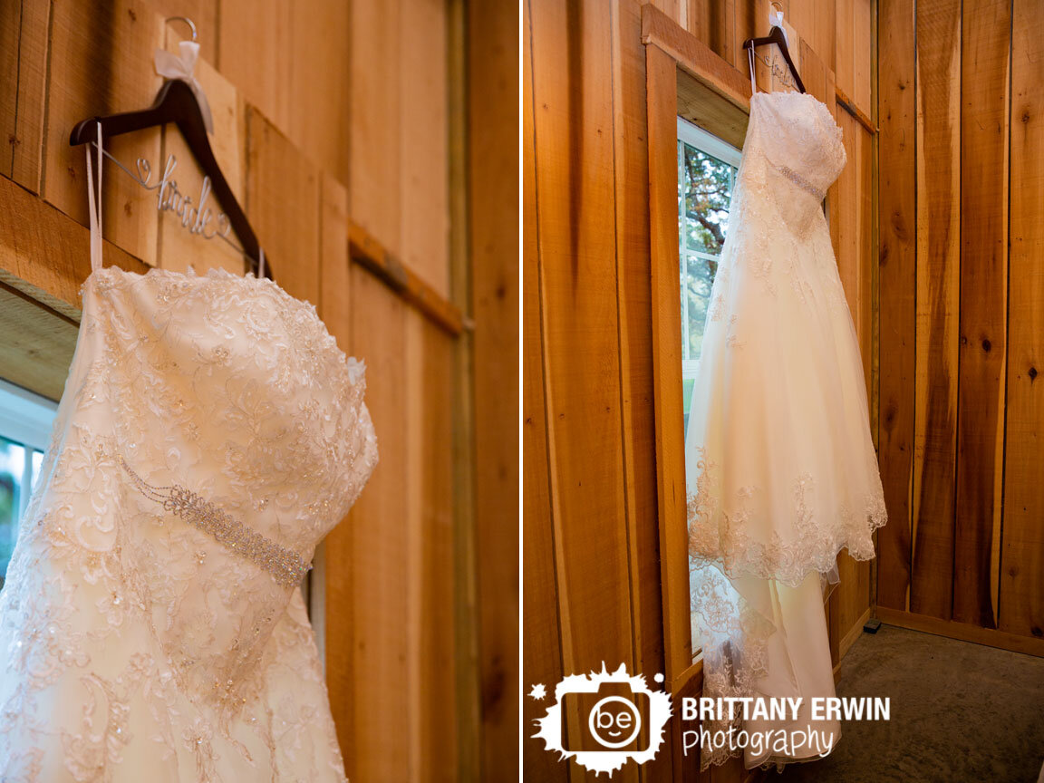 bride-hanger-wedding-dress-gown-hanging-in-window-wooden-walls.jpg