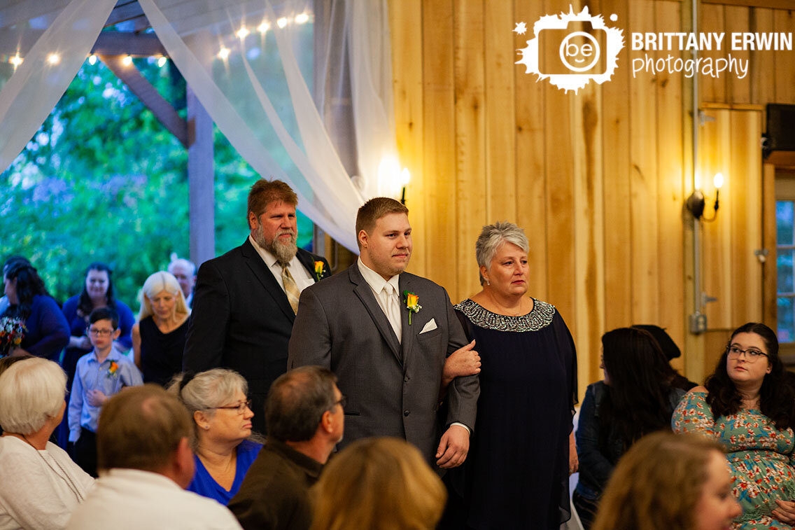 groom-walking-down-aisle-with-mother-and-father-parents.jpg