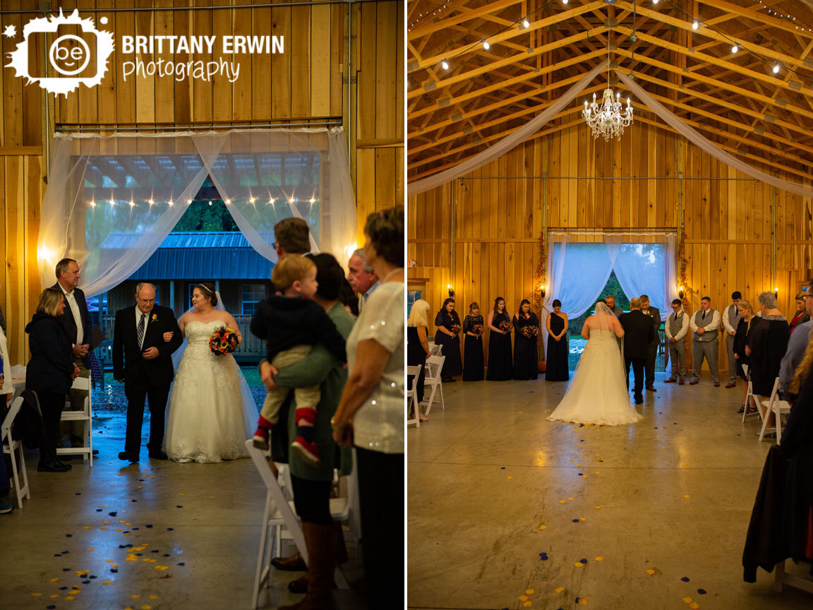 bride-walking-down-aisle-with-father-in-barn-wedding.jpg