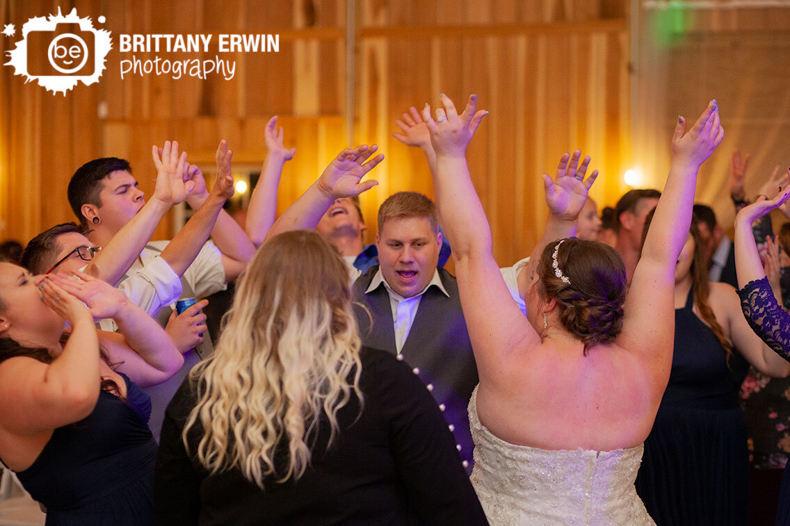 dance-floor-hands-in-the-air-barn-wedding-photographer.jpg