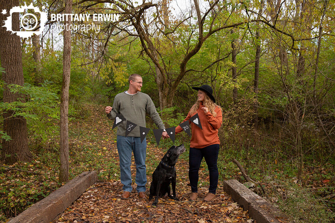 Indianapolis-engagement-photographer-date-banner-with-dog-on-bridge-fall.jpg