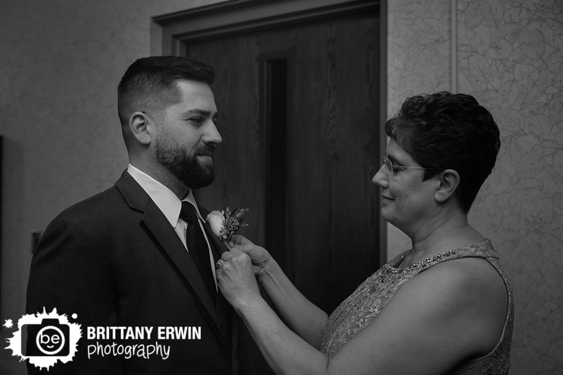 Indianapolis-wedding-photographer-mother-of-groom-putting-on-pin-boutonniere.jpg