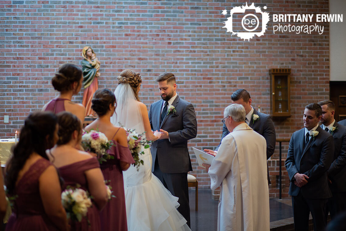 groom-emotional-holding-brides-hands-at-altar-during-wedding-ceremony.jpg