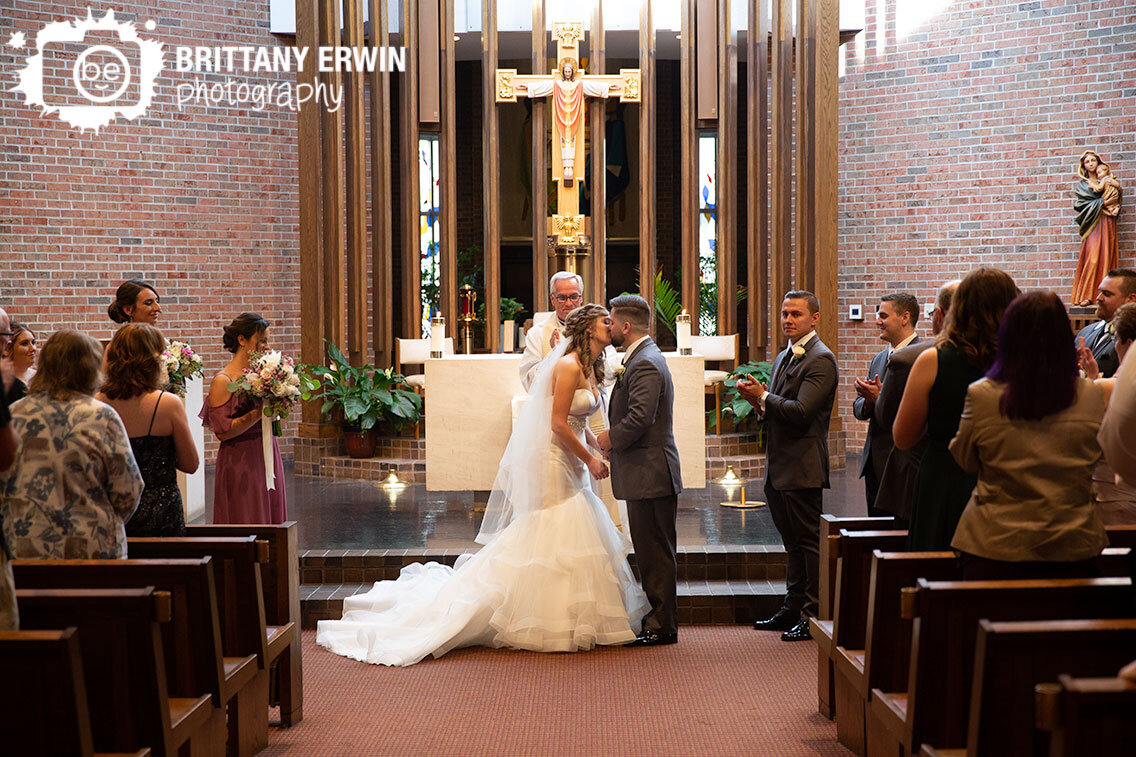 Wedding-ceremony-photographer-bride-and-groom-first-kiss.jpg