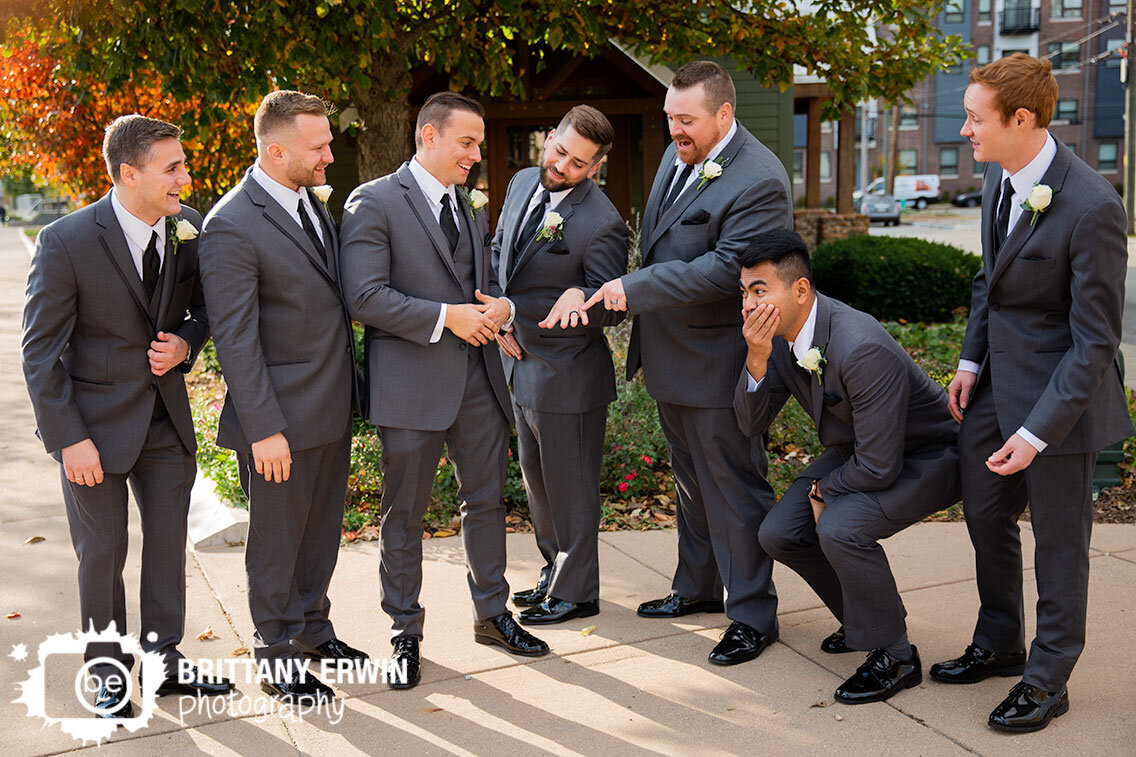 Broad-Ripple-Indiana-wedding-photographer-groom-and-groomsmen-swoon-over-ring.jpg