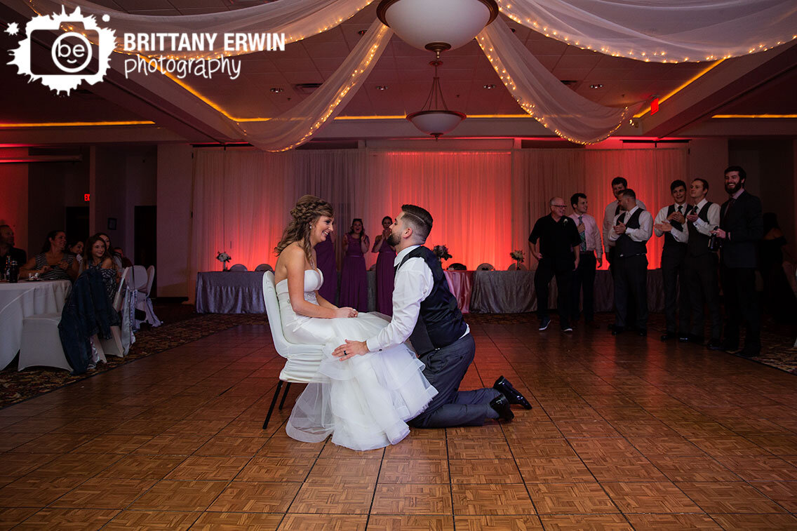 garter-toss-groom-with-bride-on-dancefloor.jpg