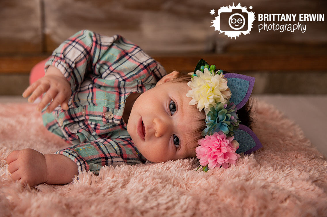 baby-girl-rolling-over-fuzzy-pink-rug-ears-headband.jpg