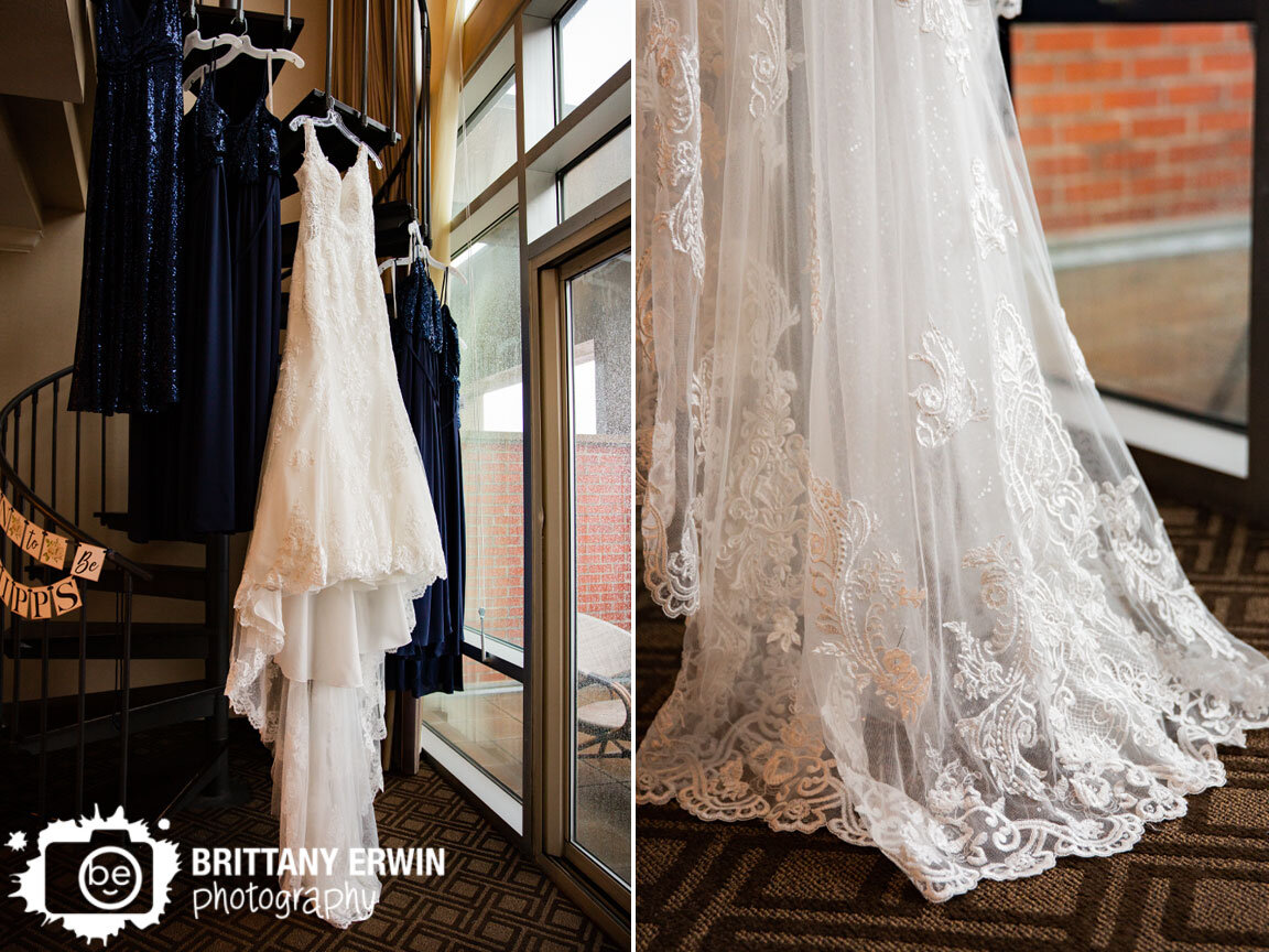 Indianapolis-wedding-photographer-bridal-gown-hanging-with-bridesmaid-dresses-lace-on-spiral-staircase.jpg