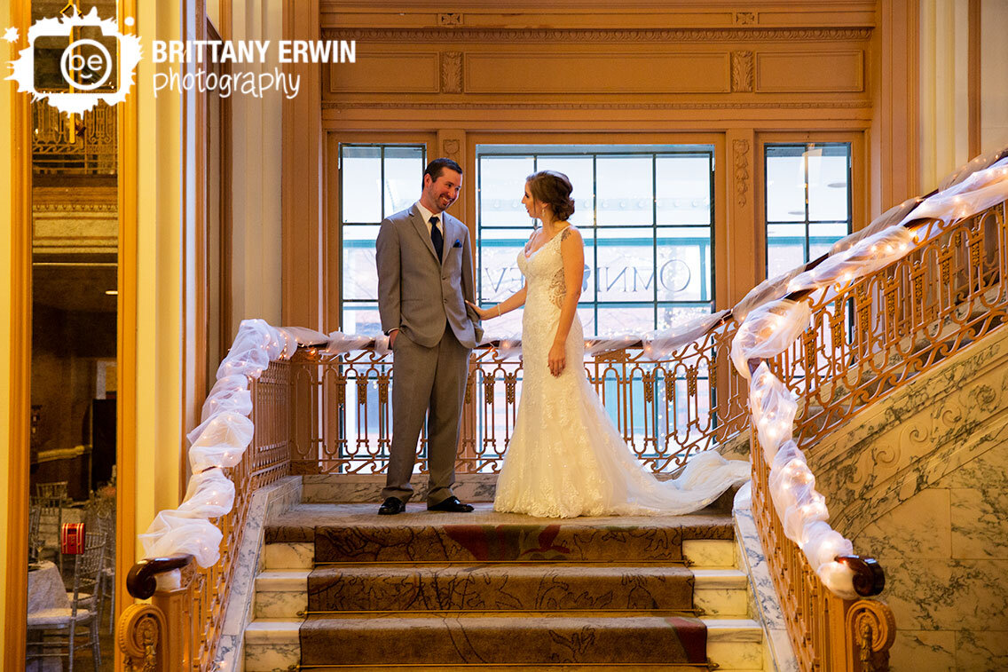 grand-staircase-first-look-couple-at-window.jpg