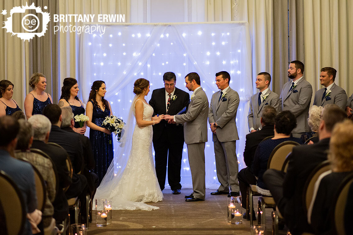 Indianapolis-wedding-photographer-bride-groom-exchange-rings-floating-candle-aisle.jpg