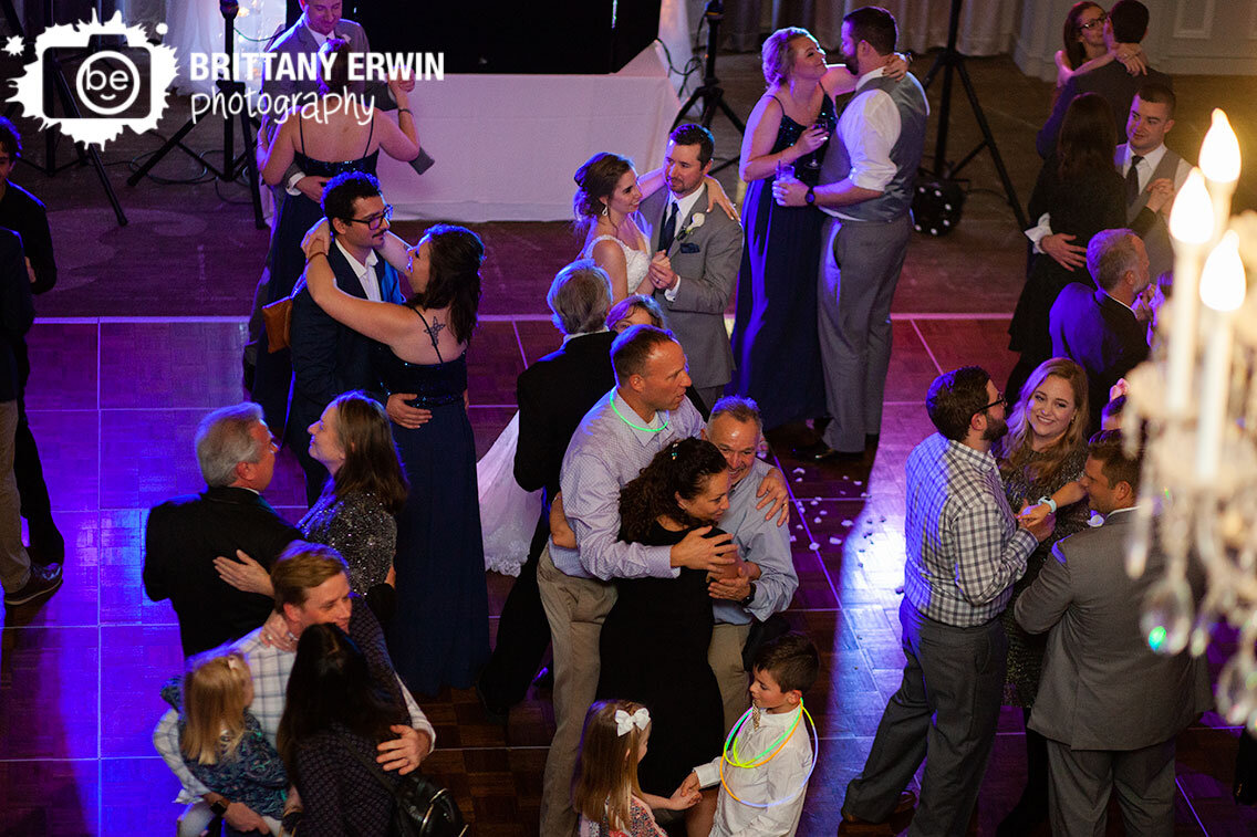 all-couples-join-bride-and-groom-couple-on-dancefloor-during-first-dance.jpg