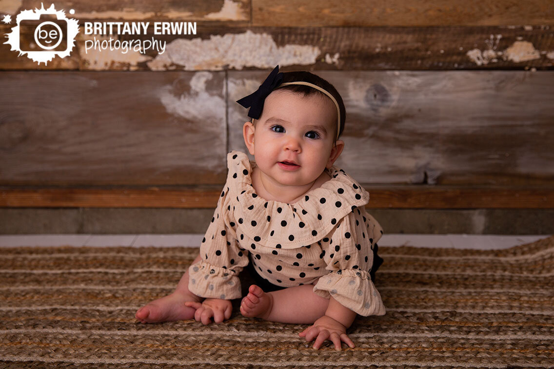 Indianapolis-portrait-studio-photographer-baby-girl-on-rustic-natural-rug-and-reclaimed-barnwood-wall.jpg