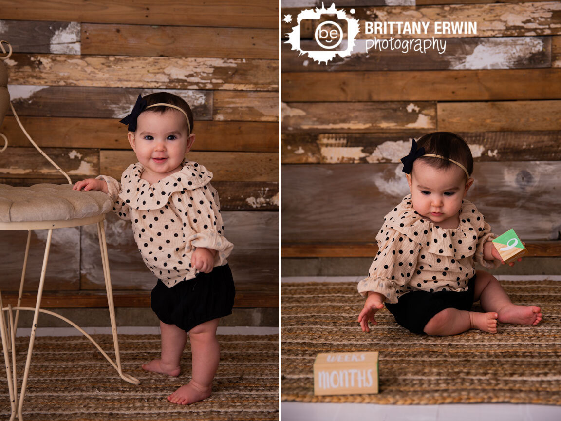 9-months-blocks-baby-girl-standing-with-vintage-chair-rustic-studio.jpg