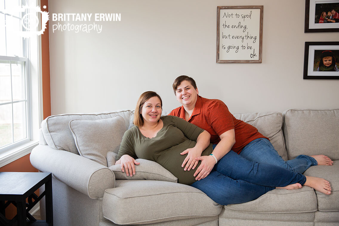 Lifestyle-maternity-portrait-photographer-couple-on-couch-relaxing-by-window.jpg