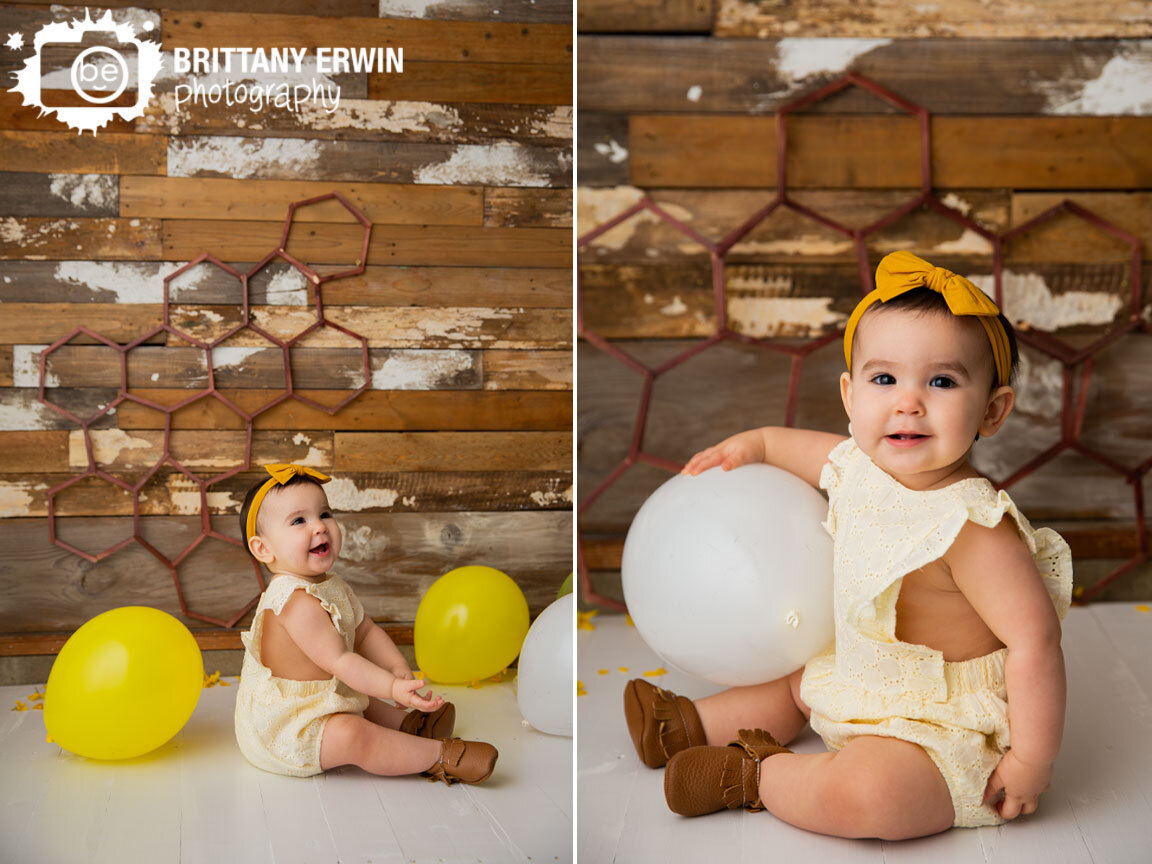 Indianapolis-portrait-photographer-baby-girl-yellow-balloons-hair-bow.jpg
