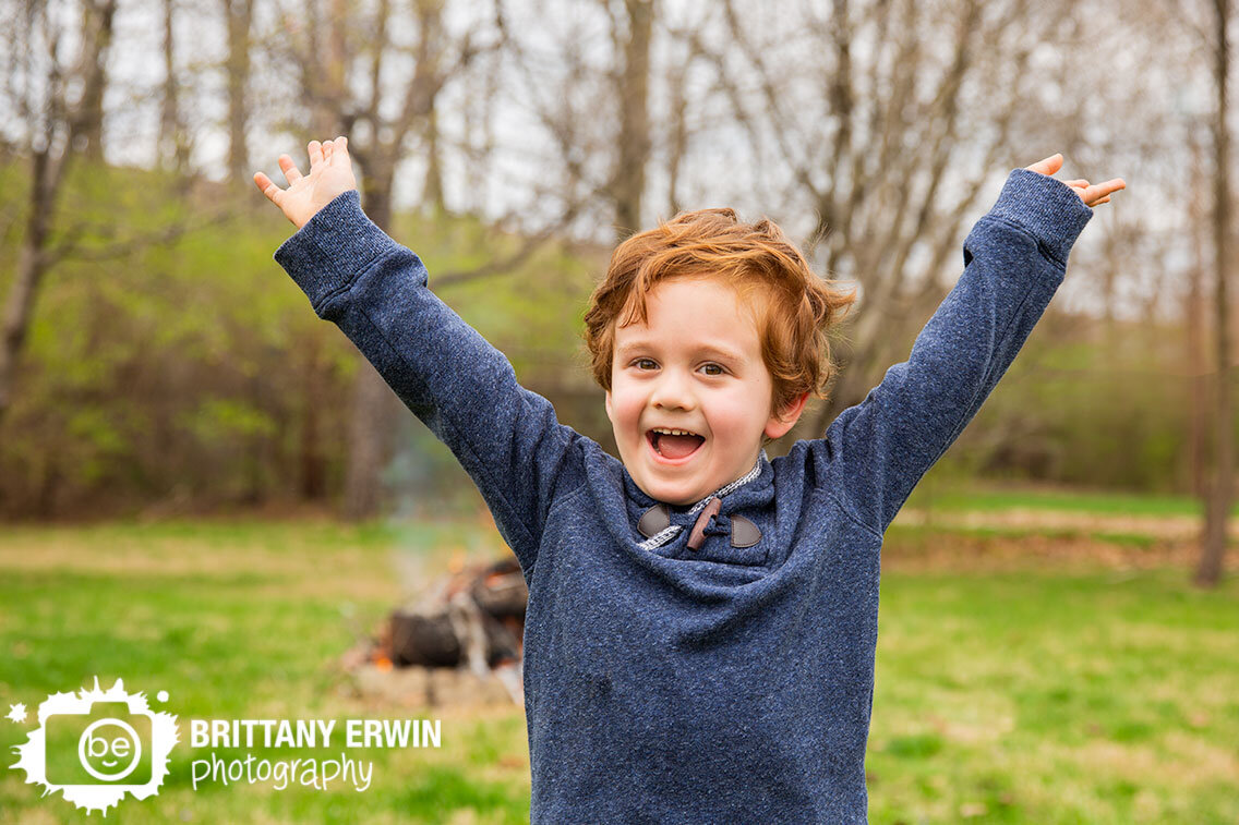 Indianapolis-portrait-photographer-4-year-old-boy-happy-outside-campfire.jpg