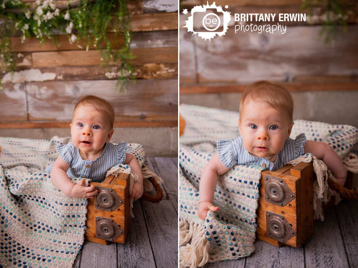 Indianapolis-portrait-studio-photographer-baby-girl-striped-romper-rustic-wood-crate.jpg