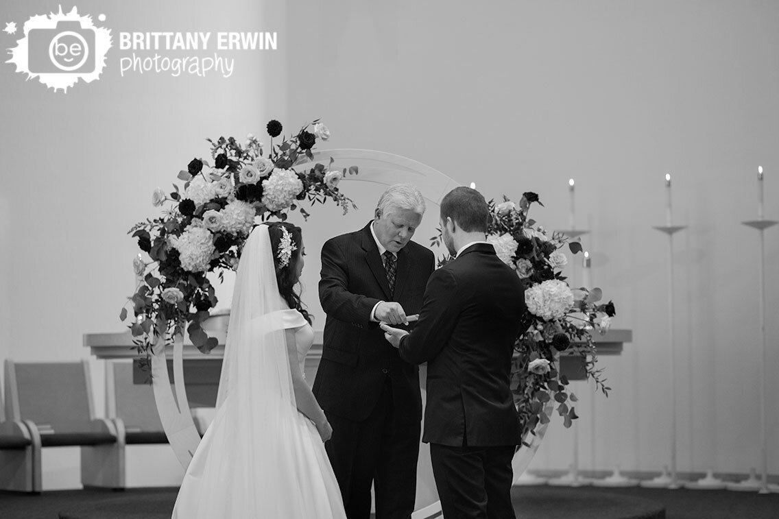 Columbus-Indiana-wedding-photographer-priest-passing-coins-to-groom.jpg