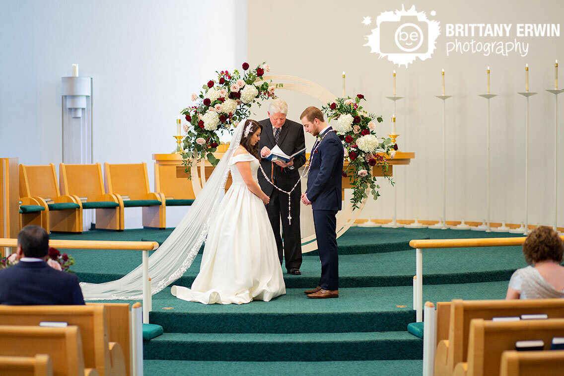 Columbus-Indiana-Saint-Peters-church-wedding-photographer-lasso-ceremony-couple-at-altar.jpg