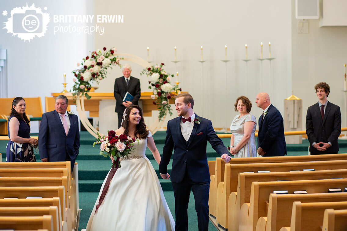 Bride-groom-walk-down-aisle-exit-announced-man-and-wife.jpg