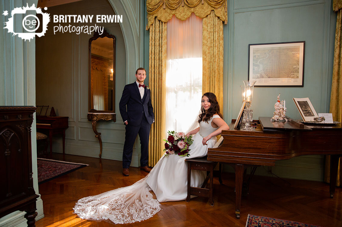Indianapolis-wedding-photographer-couple-Inn-at-Irwin-Gardens-piano-bride-groom-at-window-elegant-classic-home.jpg