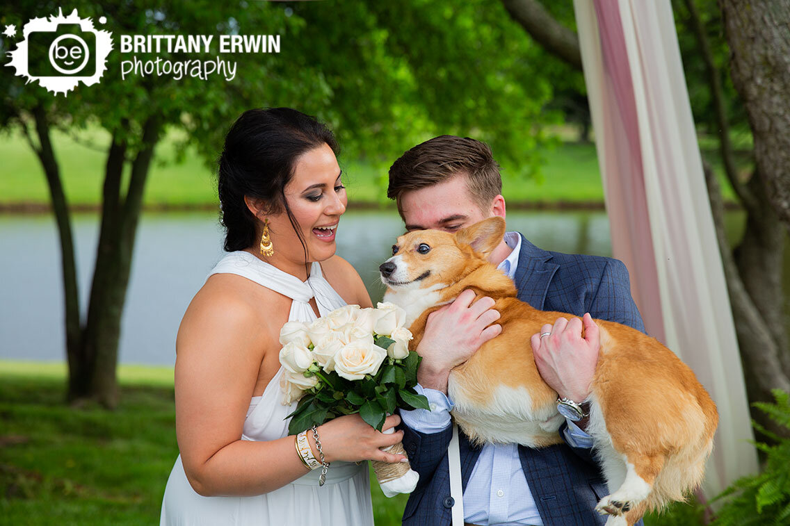 bride-groom-with-pet-corgi-dog-couple-at-altar-backyard-wedding-photographer.jpg