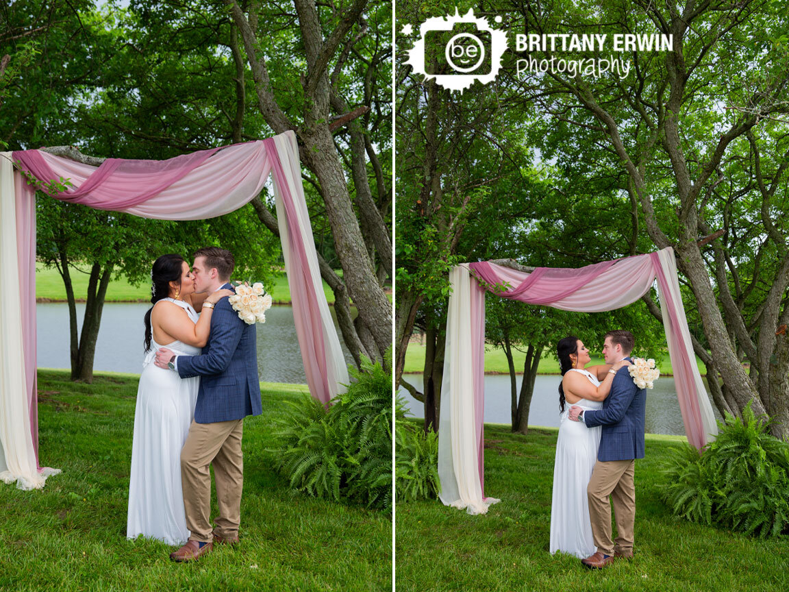 Shelbyville-Indiana-wedding-photographer-backyard-ceremony-couple-under-drapery-with-ferns.jpg