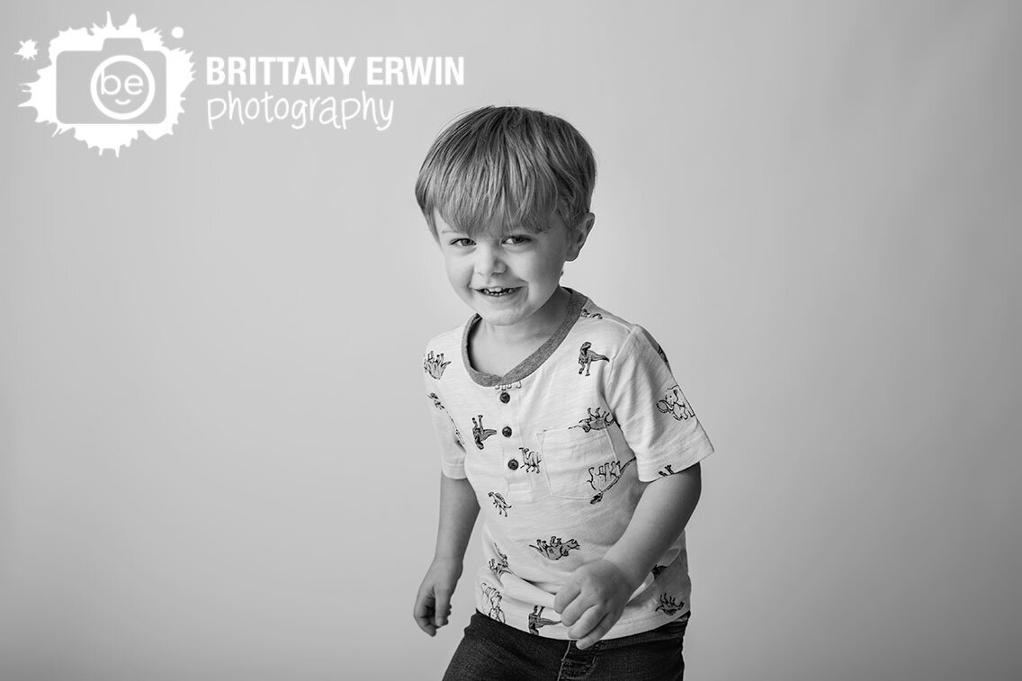 Indianapolis-portrait-studio-photographer-seamless-white-backdrop-dinosaur-shirt-toddler-birthday-boy.jpg