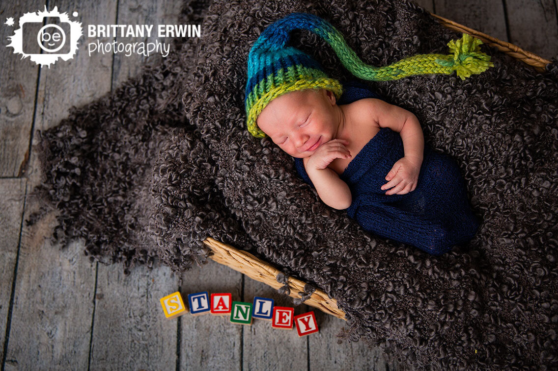 Indianapolis-newborn-portrait-photographer-name-in-blocks-sleeping-boy-sandman-hat.jpg