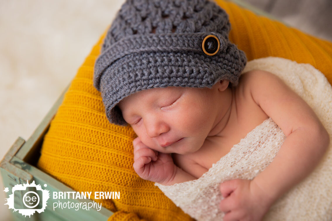 Indianapolis-portrait-studio-newborn-baby-photographer-wrapped-white-with-grey-crochet-hat.jpg