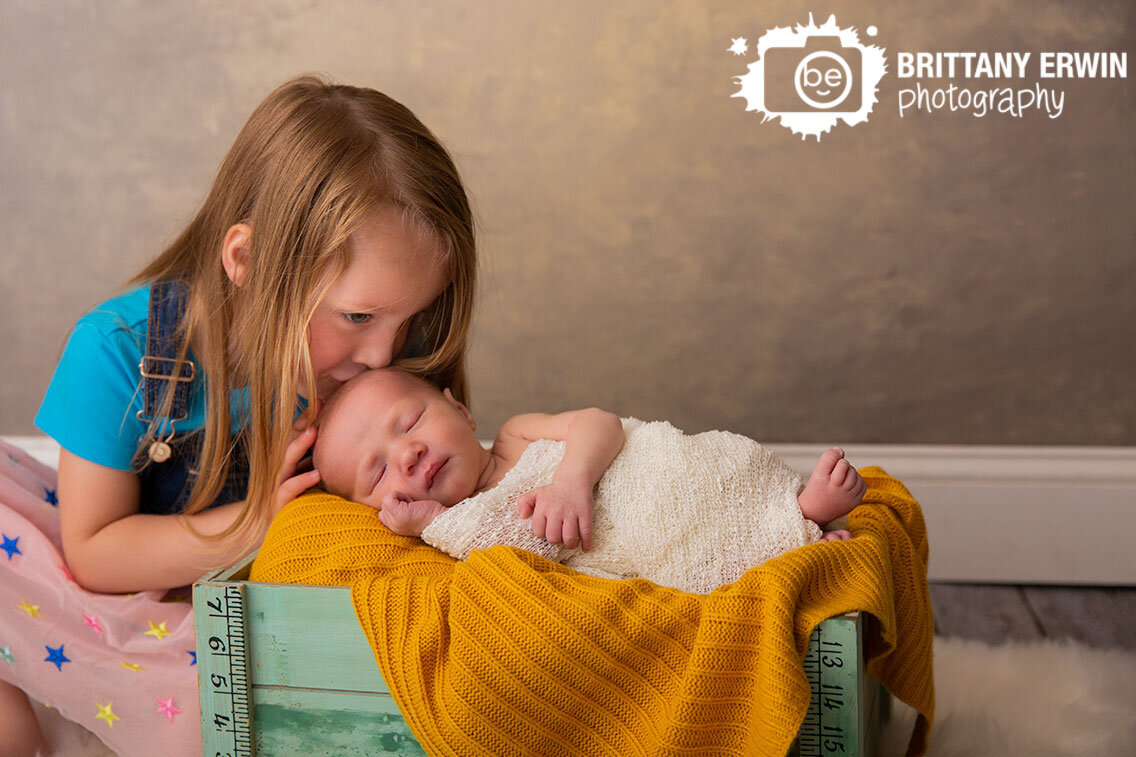 Indianapolis-portrait-studio-newborn-photographer-baby-boy-big-sister-box-with-mustard-yellow-blanket.jpg